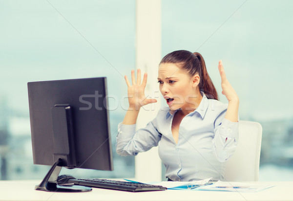 stressed woman with computer Stock photo © dolgachov