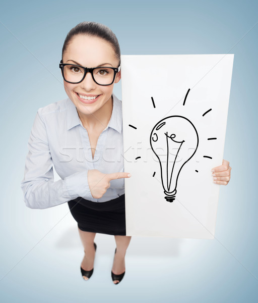 smiling businesswoman with white board Stock photo © dolgachov