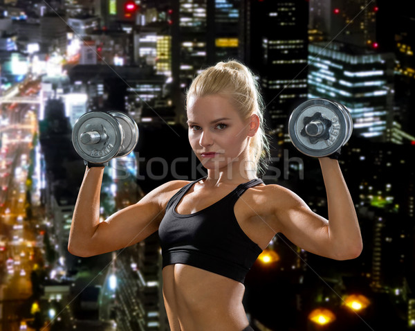 Mulher pesado aço halteres fitness Foto stock © dolgachov
