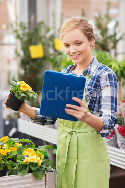 Feliz mulher estufa pessoas jardinagem Foto stock © dolgachov