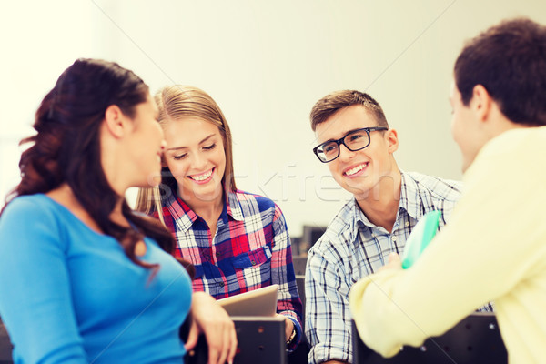 group of smiling students in lecture hall Stock photo © dolgachov