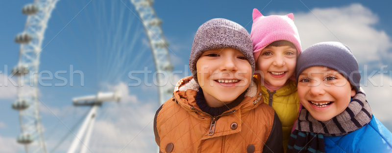 happy little children faces over ferry wheel Stock photo © dolgachov