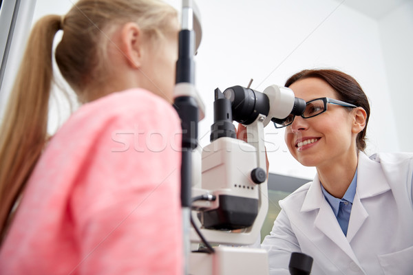 optician with tonometer and patient at eye clinic Stock photo © dolgachov