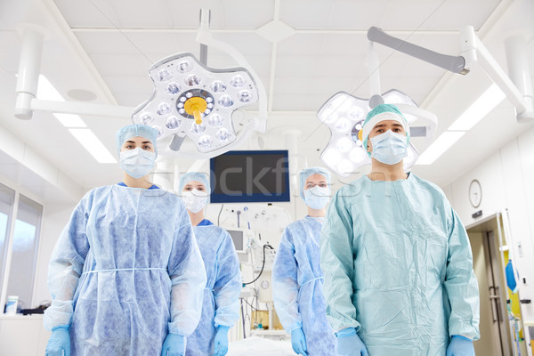 group of surgeons in operating room at hospital Stock photo © dolgachov