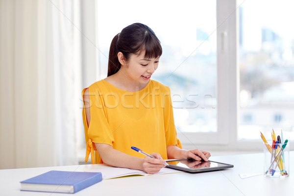 Stock photo: asian woman student with tablet pc at home