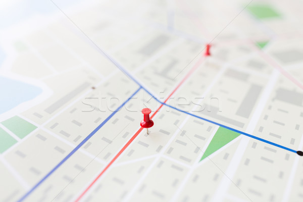 close up of map or city plan with pin Stock photo © dolgachov