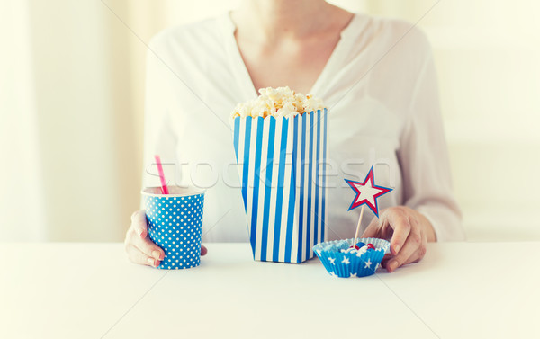 woman eating popcorn with drink and candies Stock photo © dolgachov