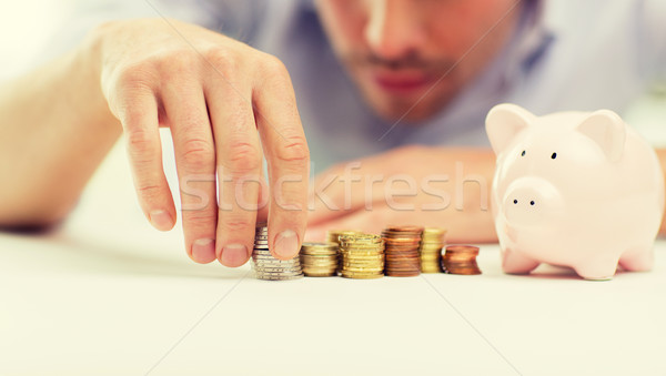 Stockfoto: Zakenman · spaarvarken · munten · zakenlieden