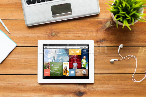 close up of tablet pc computer on wooden table Stock photo © dolgachov