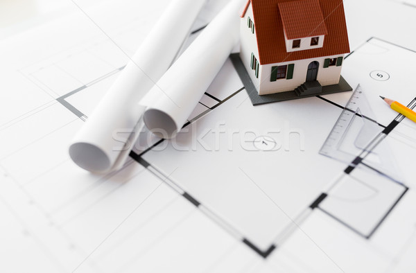 close up of house model on architectural blueprint Stock photo © dolgachov