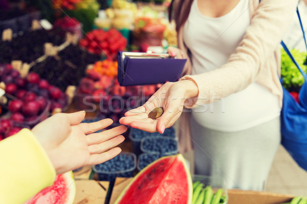 pregnant woman with wallet buying food at market Stock photo © dolgachov