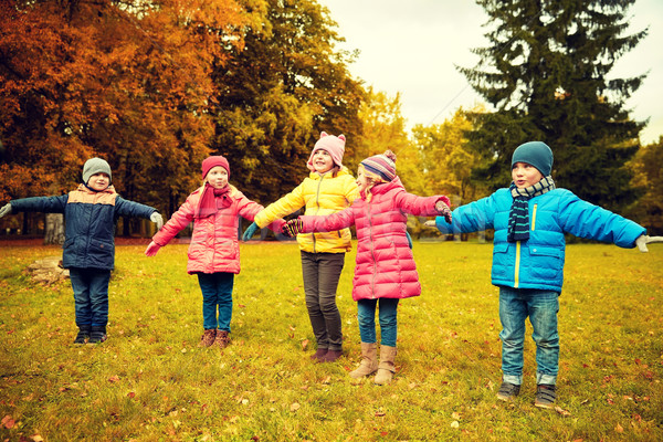 happy little children running and playing outdoors Stock photo © dolgachov