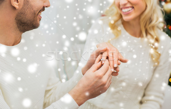 man giving diamond ring to woman for christmas Stock photo © dolgachov