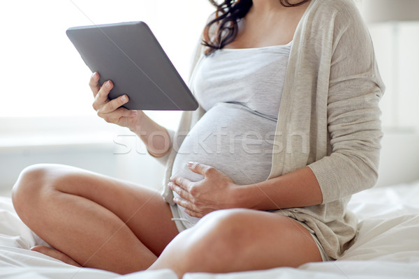 Donna incinta home gravidanza tecnologia Foto d'archivio © dolgachov