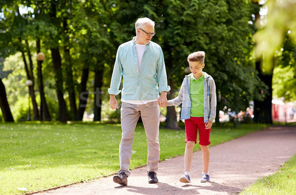 Stock photo: grandfather and grandson walking at summer park