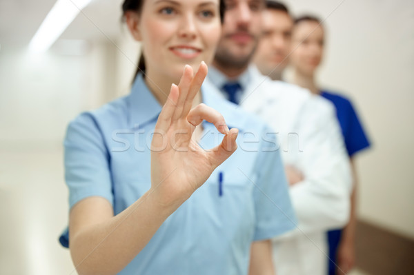 close up of doctors at hospital showing ok sign Stock photo © dolgachov