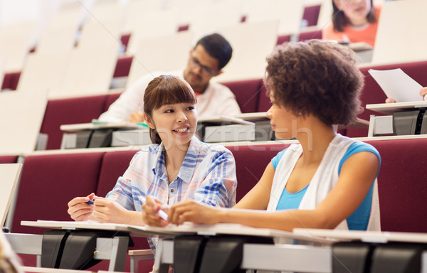 Stock photo: group of students talking in lecture hall