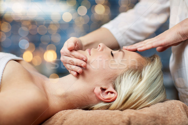close up of woman having face massage in spa Stock photo © dolgachov