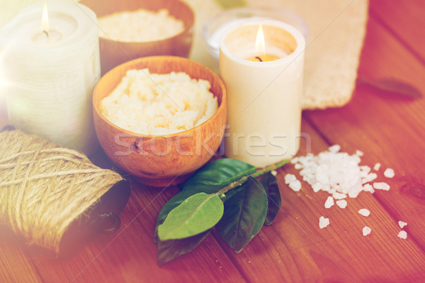 close up of natural body scrub and candles on wood Stock photo © dolgachov