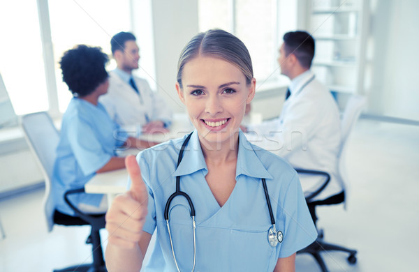 Boldog orvos csoport kórház egészségügy kézmozdulat Stock fotó © dolgachov