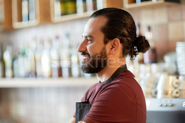 happy man, barman or waiter at bar Stock photo © dolgachov