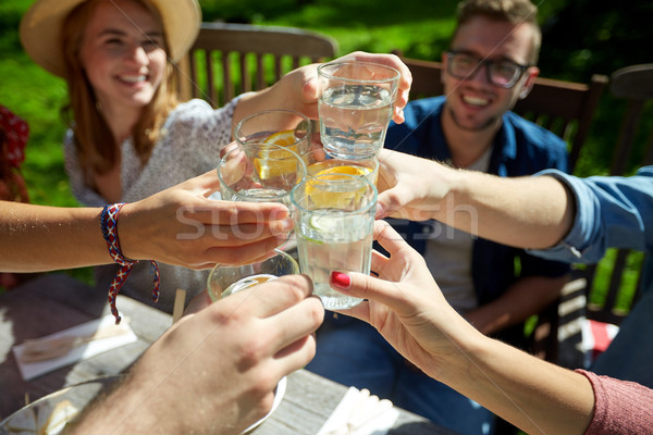 happy friends with drinks at summer garden party Stock photo © dolgachov