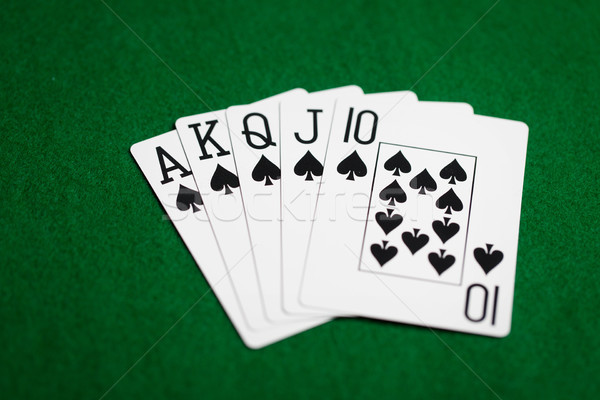 Poker hand speelkaarten groene casino doek Stockfoto © dolgachov