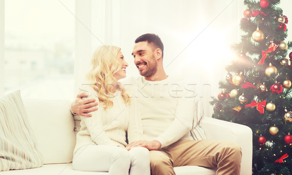 happy couple at home with christmas tree Stock photo © dolgachov