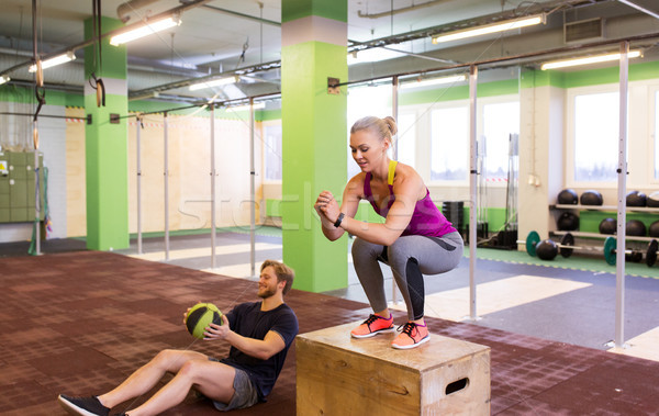 woman and man with medicine ball exercising in gym Stock photo © dolgachov