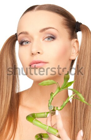 lovely redhead with bamboo in water Stock photo © dolgachov