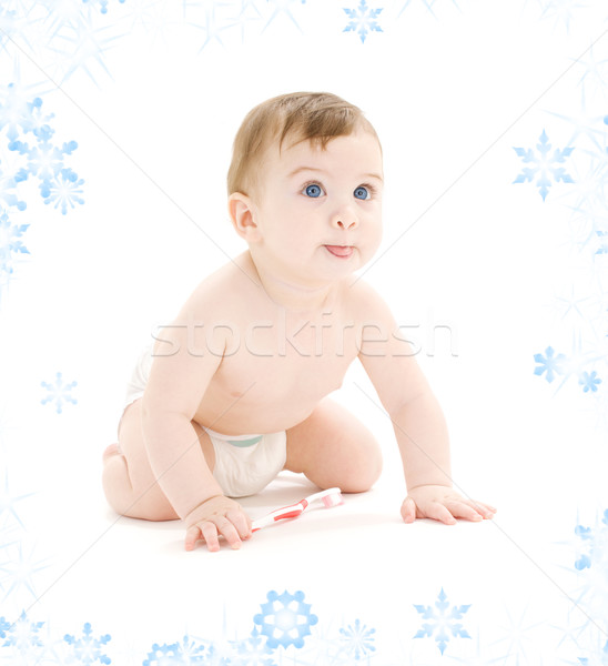 baby boy in diaper with toothbrush sticking tongue out Stock photo © dolgachov