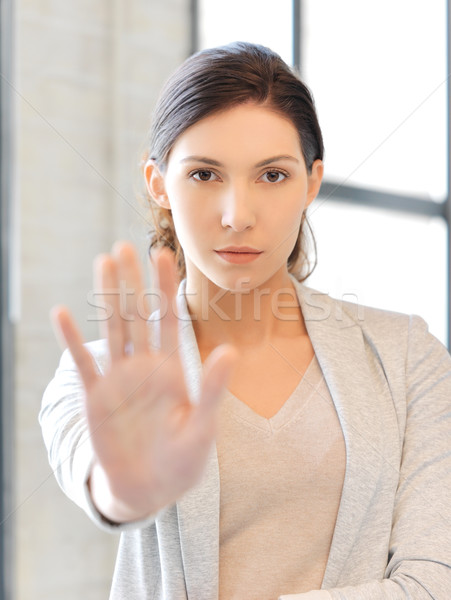 Stock photo: young woman making stop gesture
