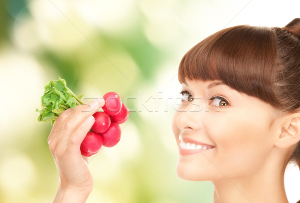 beautiful housewife with radish Stock photo © dolgachov