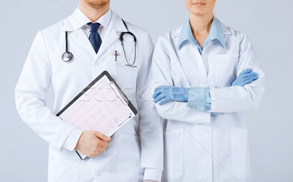 Nővér férfi orvos tart kardiogram kép nő Stock fotó © dolgachov