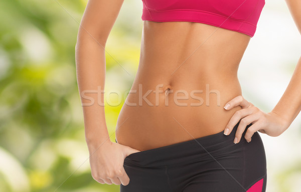 woman trained abs Stock photo © dolgachov