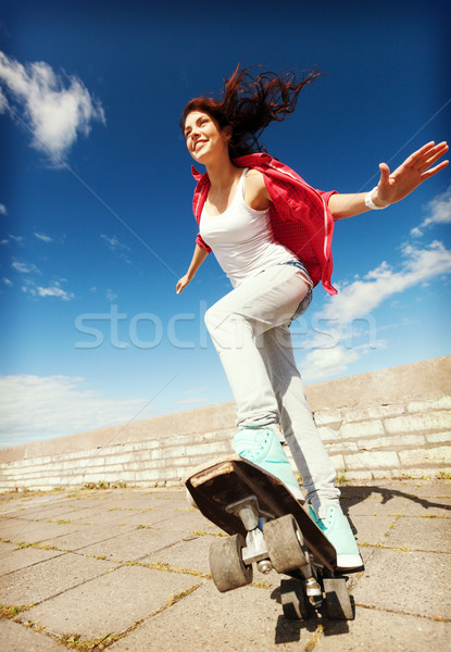 teenage girl skating outside Stock photo © dolgachov