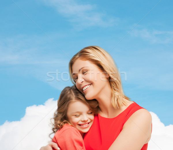 hugging mother and daughter Stock photo © dolgachov