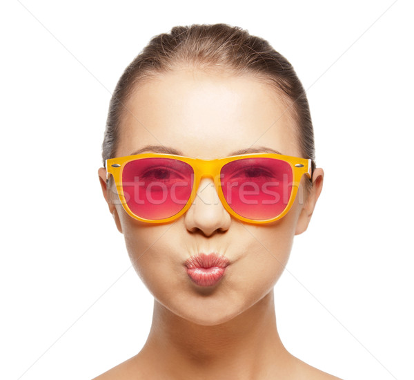 girl in pink sunglasses blowing kiss Stock photo © dolgachov
