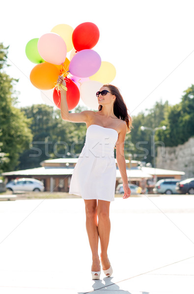 Sonriendo gafas de sol globos felicidad verano Foto stock © dolgachov