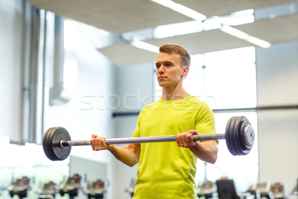 Mann Ausübung Langhantel Fitnessstudio Sport Fitness Stock foto © dolgachov