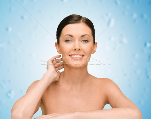 smiling young woman with bare shoulders Stock photo © dolgachov