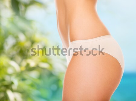 close up of young woman buttocks in pink bikini Stock photo © dolgachov