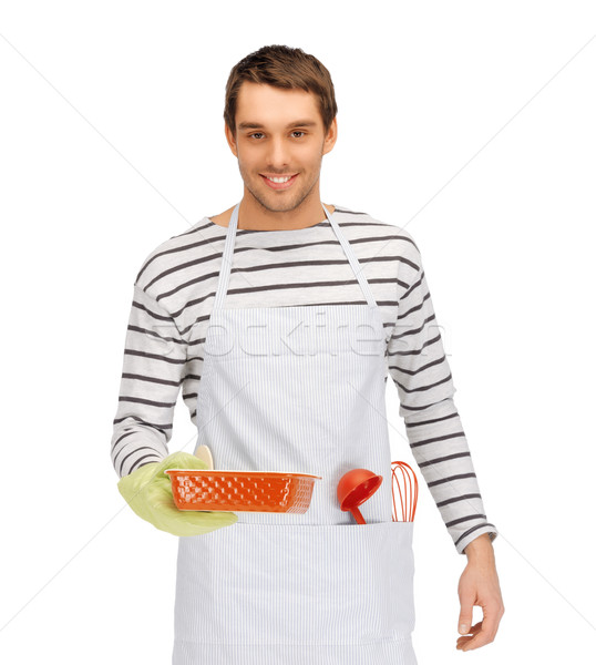 happy man or cook with baking and kitchenware Stock photo © dolgachov
