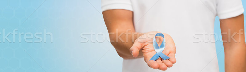 Hand Blauw prostaat kanker bewustzijn lint Stockfoto © dolgachov