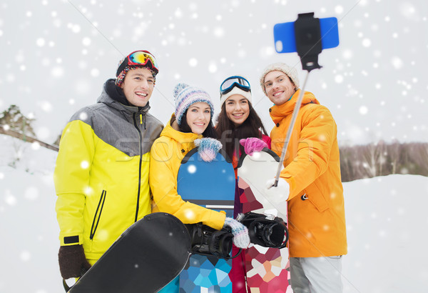 Heureux amis smartphone sports d'hiver loisirs amitié [[stock_photo]] © dolgachov