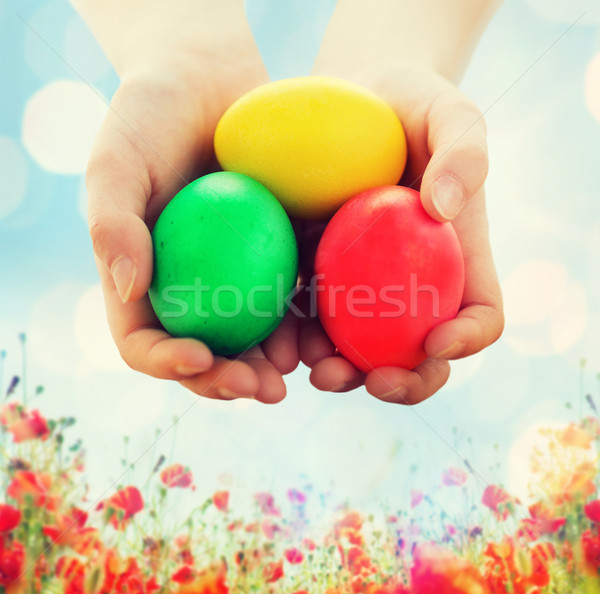 close up of kid hands holding colored eggs Stock photo © dolgachov