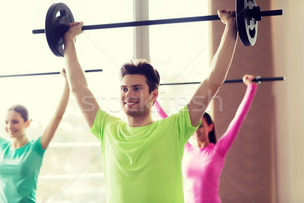 Groupe de gens barbell gymnase fitness sport [[stock_photo]] © dolgachov