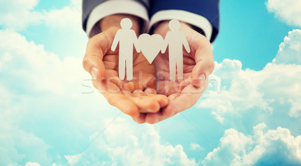 close up of happy male gay couple with love symbol Stock photo © dolgachov