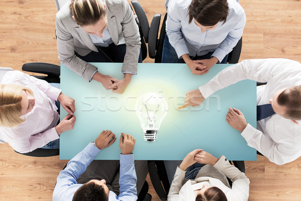 close up of business team sitting at table Stock photo © dolgachov