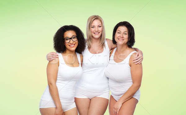 group of happy plus size women in white underwear Stock photo © dolgachov